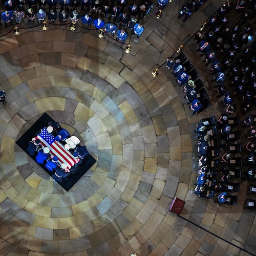 An Armed Forces Body Bearer Team moves the casket of Sen. Lindsey Graham, R-S.C., into the Rotunda of the U.S. Capitol for a Congressional tribute Tuesday, July 28, 2026, in Washington.(Kenny Holston/The New York Times via AP, Pool)