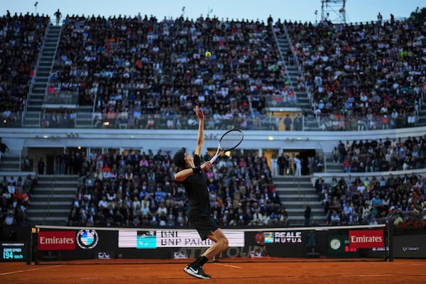 Italy's Jannik Sinner serves against Argentina's Mariano Navone during a second round match at the Italian Open tennis tournament in Rome, Saturday, May 10, 2025. (AP Photo/Andrew Medichini)