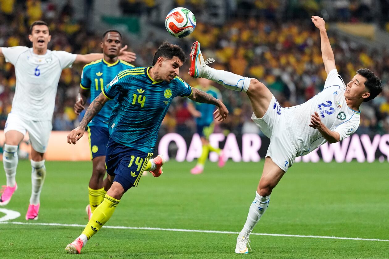 Uzbekistan's Abbosbek Fayzullaev (right) and Colombia's Gustavo Puerta compete for the ball during the World Cup Group K soccer match between Uzbekistan and Colombia in Mexico City, Wednesday, June 17, 2026. (Natacha Pisarenko/AP)