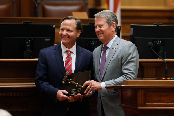 Gov. Brian Kemp (right) poses for a photo with Judge Brian Epps after swearing him in as the newest judge of the Georgia Court of Appeals at the state Capitol on Tuesday in Atlanta. (Miguel Martinez/AJC)