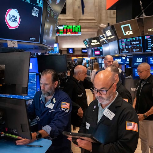 Trader Fred Demarco, right, and Specialist Michael Pistillo, left, work on the floor of the New York Stock Exchange, Friday, Aug. 7, 2026, in New York. (AP Photo/Yuki Iwamura)