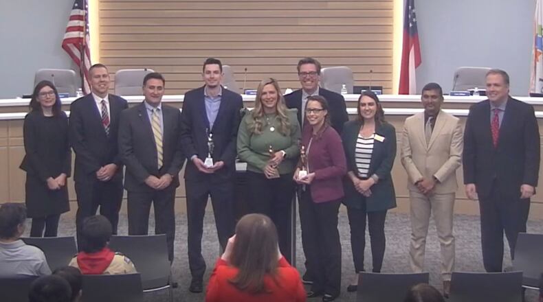 Three members of the Johns Creek Communications Department, Connor McFadden, Edie Damann and Jennifer Chapman were recently recognized by the city for receiving MarCom Awards. COURTESY CITY OF JOHNS CREEK