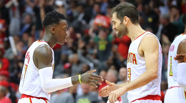Atlanta Hawks’ Dennis Schroder and Jose Calderon celebrate during a 111-101 victory over the Washington Wizards in Game 4 of a first-round NBA basketball playoff series on Monday, April 24, 2017, in Atlanta. Curtis Compton/ccompton@ajc.com