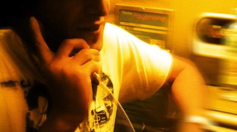 File photo of a man talking on a phone.