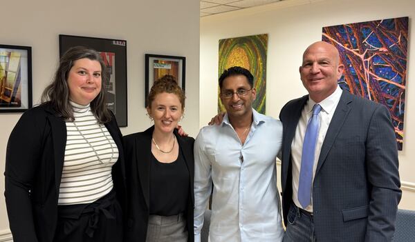 Sonny Bharadia (third from left) stands with his legal team after his release from prison last year. The DeKalb County native spent 23 years in prison for a crime he did not commit. His attorneys included Georgia Innocence Project senior Attorney Christina Cribbs (left), former staff attorney Olivia Vigiletti and Atanta defense attorney Noah Pines. (Courtesy of Georgia Innocence Project)