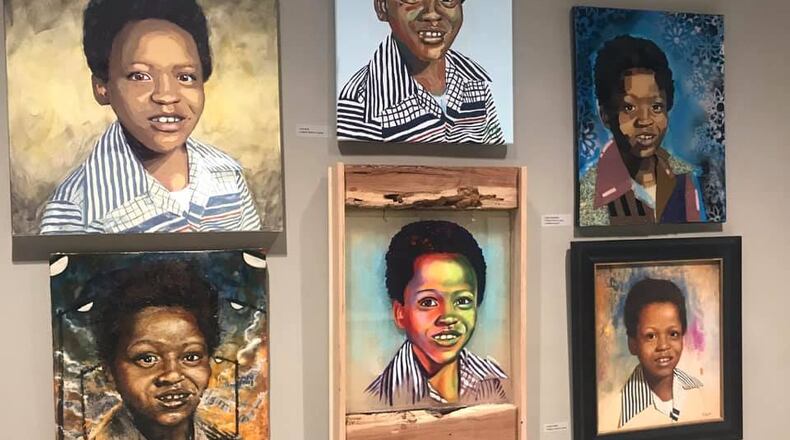 These portraits of Clifford Jones, one of the Atlanta Missing and Murdered Children victims, align the hallway into the Mayor’s office. Mayor Keisha Lance Bottoms thanked all of the artists who submitted their work in honor of the children who’s lives were taken at a ceremony Thursday, Jan. 16. COURTESY OF THE CITY OF ATLANTA