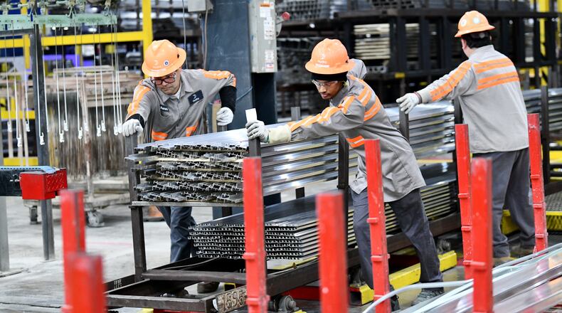 Workers work on aluminum products at finish line at Hydro’s aluminum extrusion plant, Wednesday, Feb. 25, 2026, in Gainesville. (Hyosub Shin/AJC)