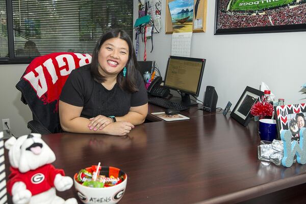 Hope Beckham Inc. account director Wendy Hsiao poses for a portrait in her Atlanta office. (Alyssa Pointer/alyssa.pointer@ajc.com)