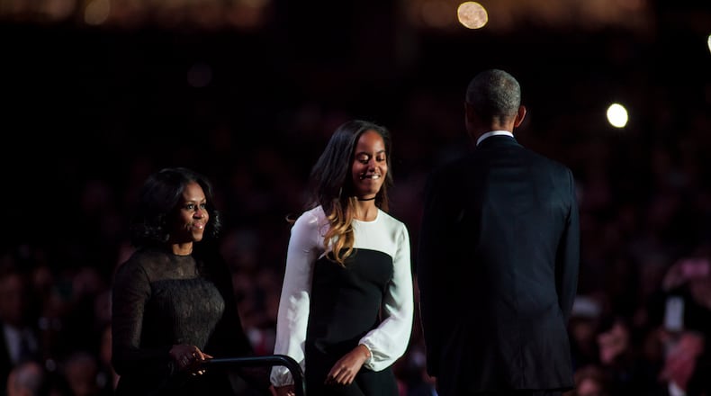 CHICAGO, IL - JANUARY 10: U.S. President Barack Obama greets daughter Malia and first lady Michelle Obama on stage after delivering his farewell address at McCormick Place on January 10, 2017 in Chicago, Illinois. (Photo by Darren Hauck/Getty Images)