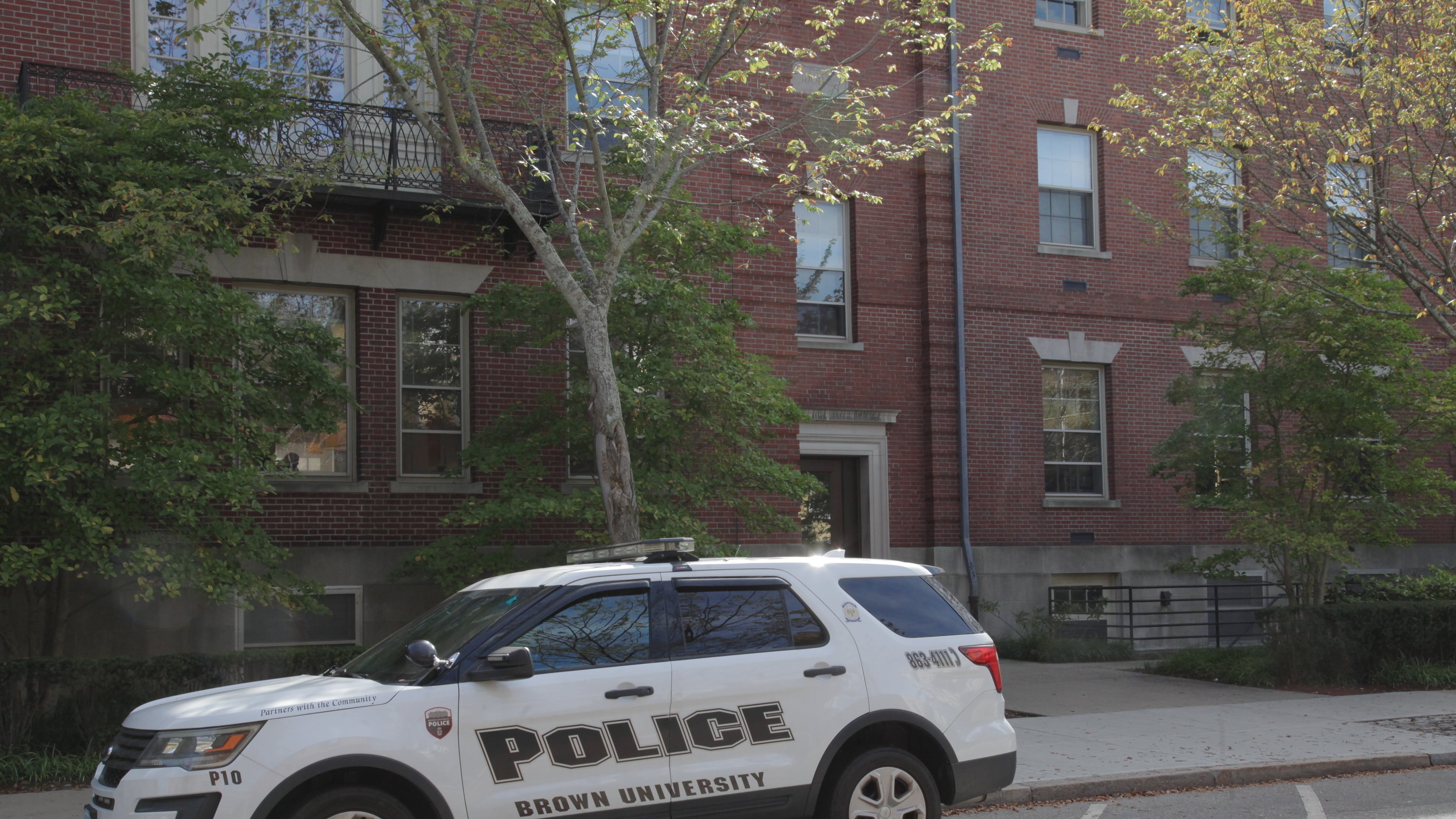 A Brown University police vehicle parks near campus, in Providence, R.I., Monday, Sept. 29, 2025. (AP Photo/Kimberlee Kruesi)