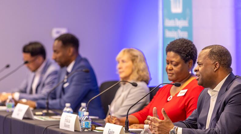 Former mayor and current mayoral candidate Kasim Reed (far right) spokes at an event hosted by the Atlanta Regional Mayoral Forum on Wednesday. (Jenni Girtman for The Atlanta Journal-Constitution)
