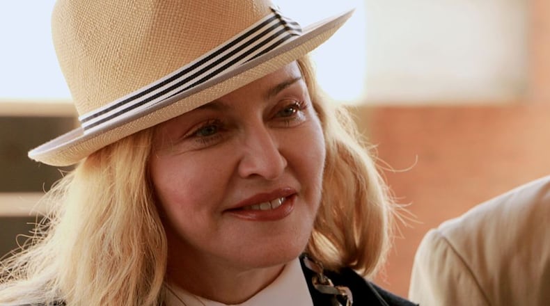 Pop diva Madonna is pictured here at a charity event in Malawi in 2016. The ‘Material Girl’ just released a couple racy photos on Instagram, then took the nude image down.