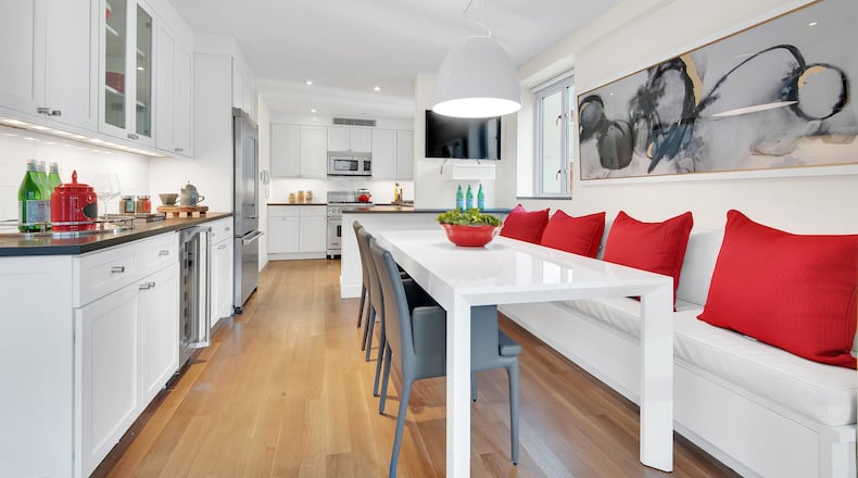 White, gray and tomato red are popular in fashion, but not as popular in home decor. Still, they help make this kitchen shine. (Design Recipes)