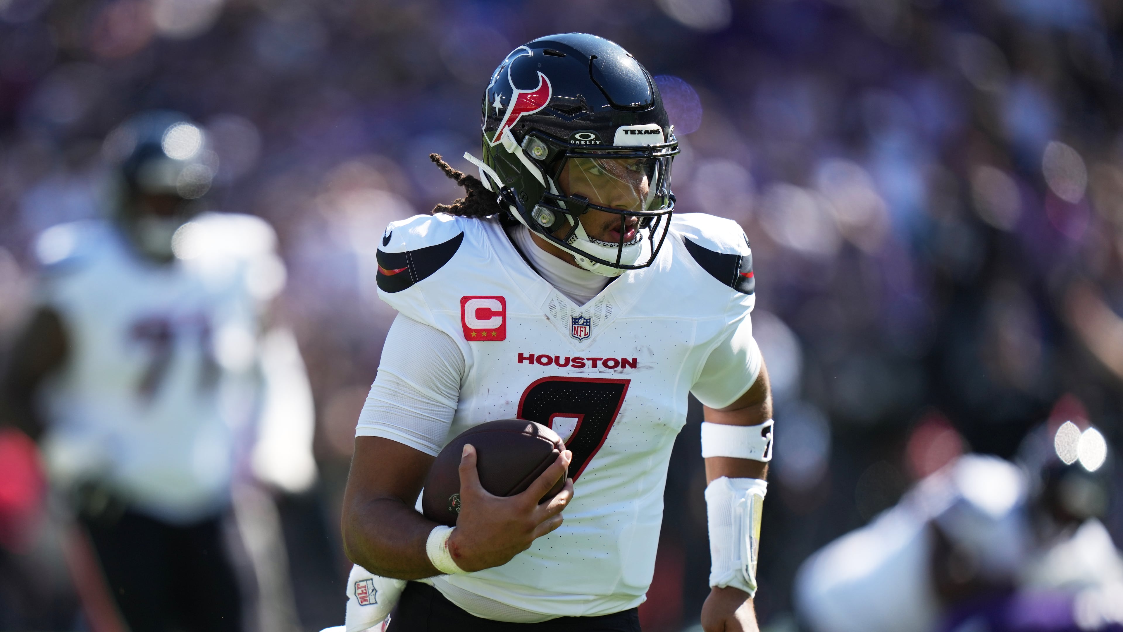 Houston Texans quarterback C.J. Stroud (7) runs the ball during the first half of an NFL football game against the Baltimore Ravens, Sunday, Oct. 5, 2025, in Baltimore. (AP Photo/Stephanie Scarbrough)