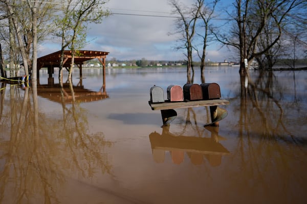 The rising Ohio River floods along Lower River Road, Monday, April 7, 2025, in Rabbit Hash, Ky. (AP Photo/Carolyn Kaster)