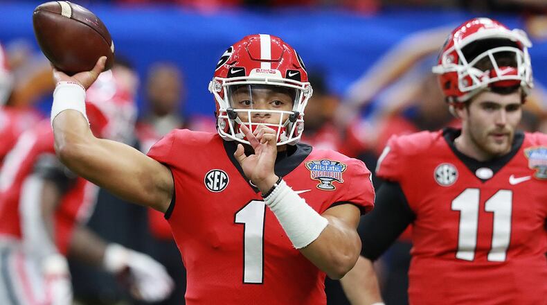 Georgia quarterbacks Justin Fields (1) and Jake Fromm prepare to play Texas in the Sugar Bowl at Mercedes-Benz Superdome on Tuesday,  Jan. 1, 2019, in New Orleans. Curtis Compton/ccompton@ajc.com