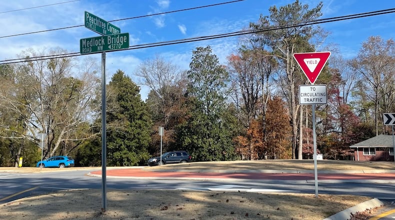 New roundabout in Peachtree Corners has drivers appreciating the increased traffic flow at Peachtree Corners Circle and Medlock Bridge Road. (Photo by Karen Huppertz for the AJC)