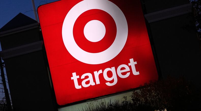 FILE - The Target logo displayed on a sign outside a store, Nov. 18, 2025, in Salem, N.H. (AP Photo/Charles Krupa, File)