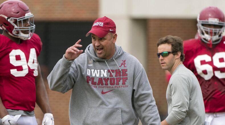 Alabama defensive coordinator Jeremy Pruitt works with his players during football practice at the Thomas-Drew Practice Fields in Tuscaloosa, Ala. (Vasha Hunt/AL.com via AP)