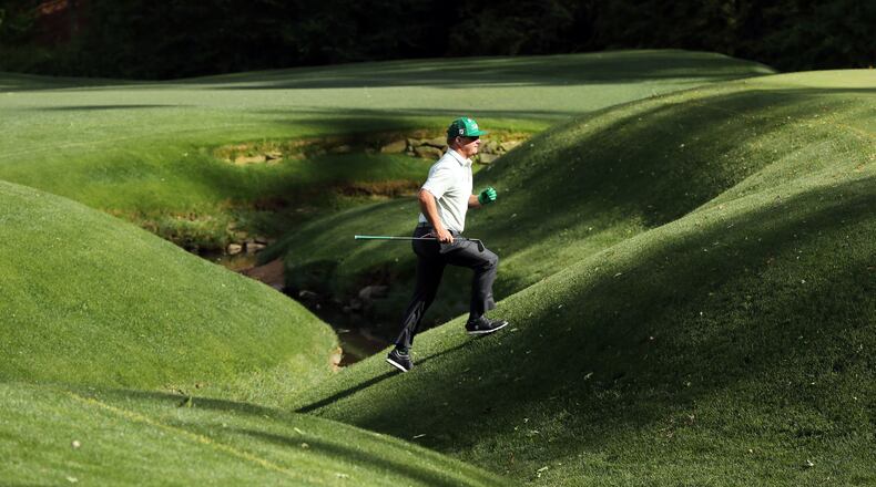 Charley Hoffman crosses the creek on the 13th hole after hitting in it from the fairway at the 81st Masters tournament at the Augusta National Golf Club, Thursday April 6, 2017. CURTIS COMPTON/ AJC