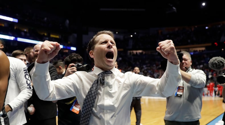 Nevada head coach Eric Musselman celebrates as his team defeated Cincinnati during a second-round game in the NCAA college basketball tournament in Nashville, Tenn., Sunday, March 18, 2018. Nevada defeated Cincinnati 75-73. (AP Photo/Mark Humphrey)