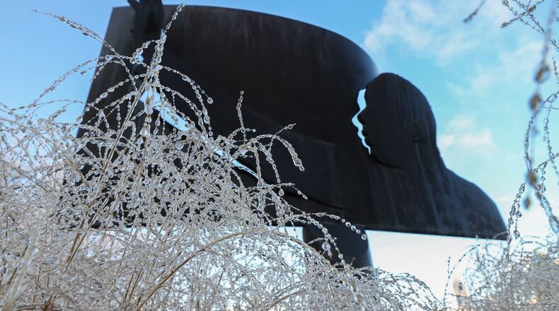 Ice from the storm is near the image of Martin Luther King Jr. JOHN SPINK / JSPINK@AJC.COM