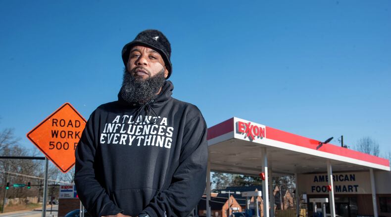 February 24, 2021 Atlanta - Portrait of Brian Page outside the Exxon gas station in his Southwest DeKalb neighborhood on Wednesday, February 24, 2021. Page launched a protest and boycott of the Exxon gas station in his Southwest DeKalb neighborhood, after a clerk told one customer he "didn't give a f--- about the black community" and the owner called him a "food stamp cockroach." They protested outside the store for 66 days -- and it worked. The owner agreed to sell. (Hyosub Shin / Hyosub.Shin@ajc.com)