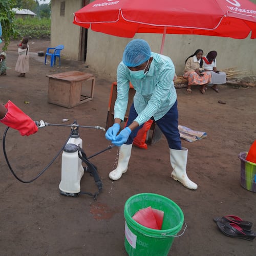 Wiza Bondele, Right, a health worker on the prevention and control team, seen at work in Ituri province, eastern Congo, Wednesday, Aug 5, 2026. (AP Photo/Dieudonne Dirole)