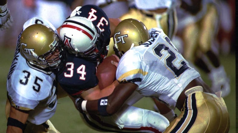 Georgia Tech great Keith Brooking (35) was named an ACC legend this week and will be honored at the ACC championship game in December in Charlotte, N.C. (AP Photo/John Miller)