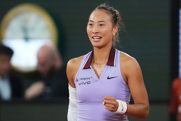China's Zheng Qinwen smiles after beating Russia's Anastasia Pavliuchenkova during their first round match of the French Tennis Open at the Roland Garros stadium, in Paris, Sunday May 25, 2025. (AP Photo/Lindsey Wasson)
