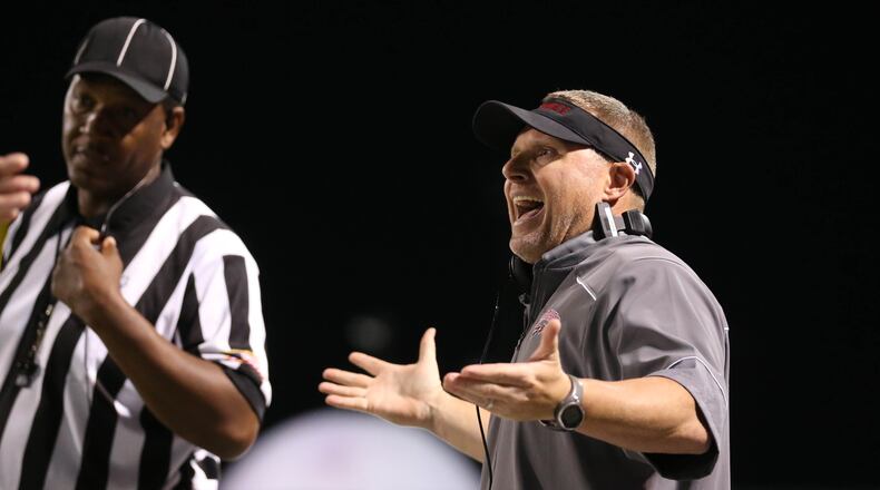 November 4, 2016 - Roswell, Ga: Cherokee head coach Josh Shaw argues a call with an official in the first half of their game against Roswell at Roswell High School Friday November 4, 2016, in Roswell, Ga. The winner is the Region 4-AAAAAAA champion. PHOTO / JASON GETZ