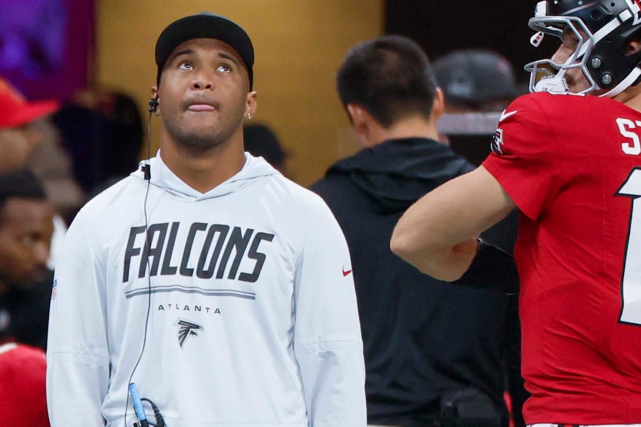 Falcons quarterback Tua Tagovailoa watches from the sidelines as his team faces the Carolina Panthers at Mercedes-Benz Stadium on Sunday, Sept. 20, 2026, in Atlanta. The Falcons expect the 28-year-old to be a positive contributor in whatever capacity his health, and opportunity, provides. (Miguel Martinez/AJC)