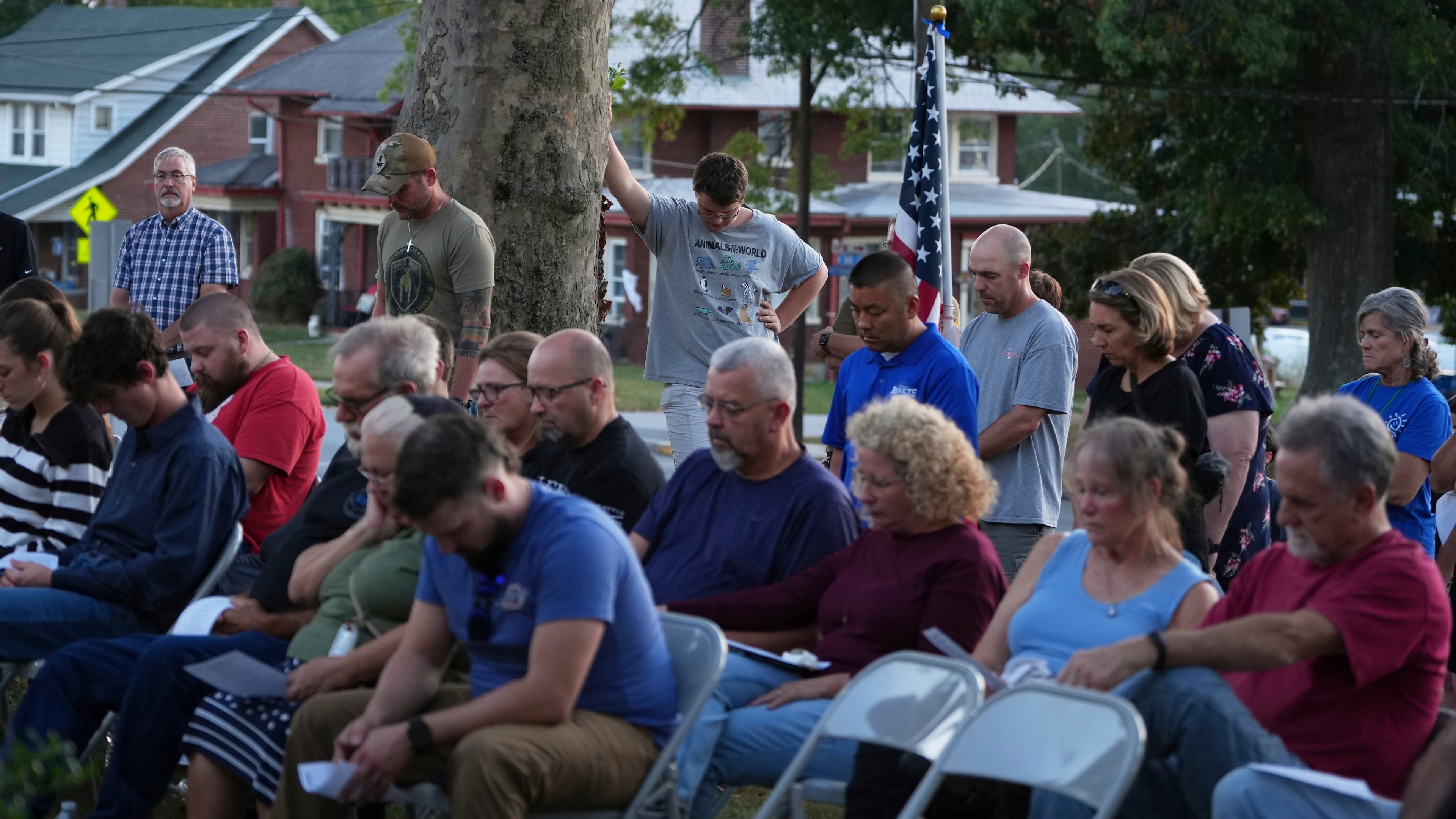 Attendees react during a vigil at Spring Grove Alliance church Thursday, Sept. 18, 2025, in Spring Grove, Pa., after multiple police officers were shot and killed. (AP Photo/Matt Slocum)