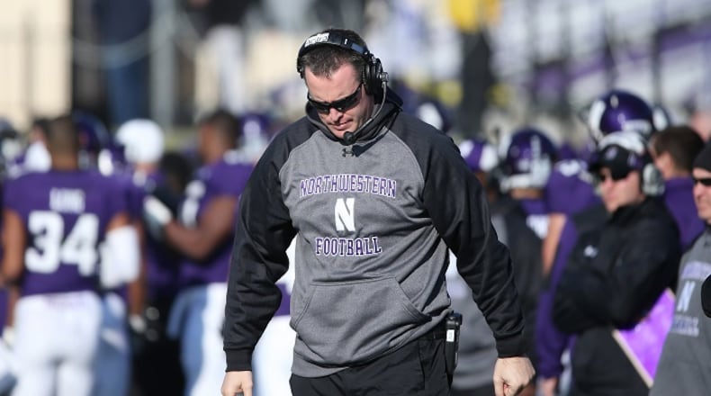 Northwestern head coach Pat Fitzgerald looks down after an Illinois touchdown in the third quarter at Ryan Field in Evanston, Ill., on Saturday, Nov. 29, 2014. Northwestern has canceled its Saturday spring game. (John J. Kim/Chicago Tribune/TNS)