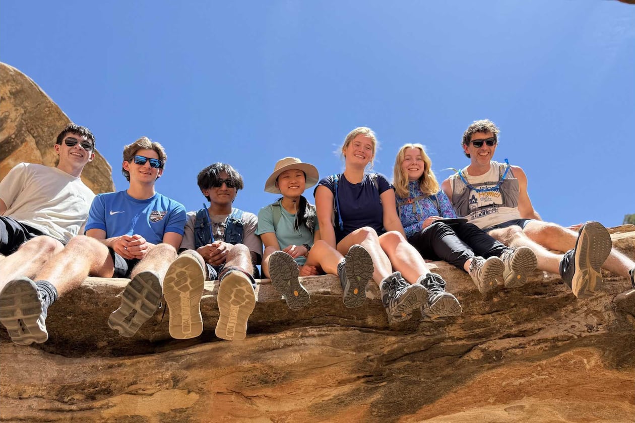 Emory University students pose for a picture with their chaplain, Brent Huckaby (right), in Utah’s Capitol Reef National Park. (Courtesy)