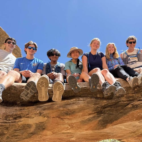 Emory University students pose for a picture with their chaplain, Brent Huckaby (right), in Utah’s Capitol Reef National Park. (Courtesy)