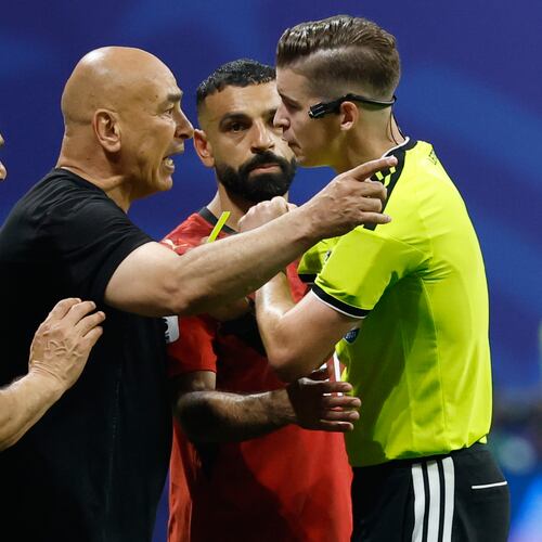 Egypt head coach Hossam Hassan argues with referee Francois Letexier, of France, during the World Cup round of 16 soccer match between Argentina and Egypt in Atlanta, Tuesday, July 7, 2026. (AP Photo/Erik S. Lesser)
