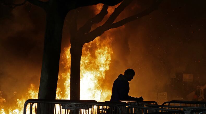 Demonstrators protesting a scheduled campus speaking appearance by Breitbart News editor Milo Yiannopoulos set a fire on Sproul Plaza at the University of California Berkeley campus in 2017. (AP Photo/Ben Margot, File)