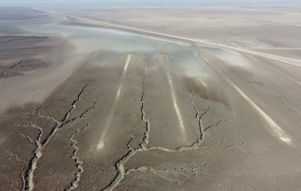 An aerial photo shows an archaeological site where researchers dated some of the massive earthen structures, believed to have been built with slave labor, and found that their construction spanned several centuries, near Basra, Iraq, Saturday, Jan. 29, 2022. (AP Photo/Jaafar Jotheri)