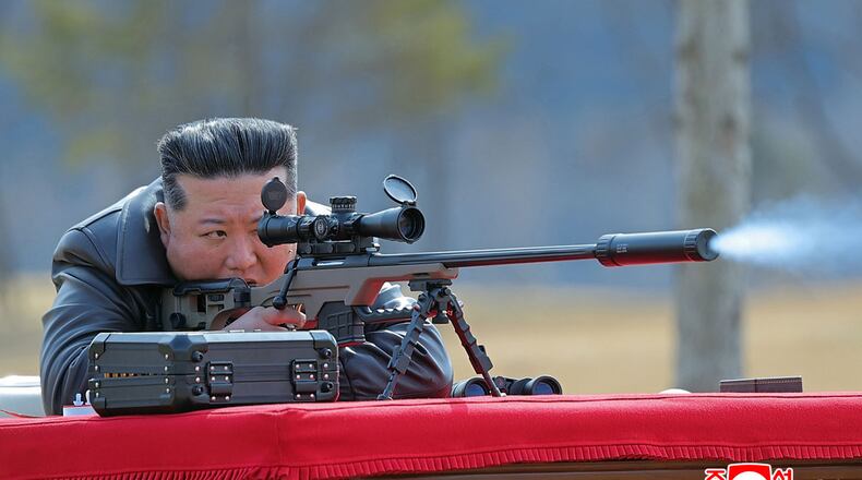 In this photo provided by the North Korean government, its leader Kim Jong Un test-fires a new sniper rifle at a shooting range in an undisclosed location, North Korea Friday, Feb. 27, 2026. Independent journalists were not given access to cover the event depicted in this image distributed by the North Korean government. The content of this image is as provided and cannot be independently verified. Korean language watermark on image as provided by source reads: "KCNA" which is the abbreviation for Korean Central News Agency. (Korean Central News Agency/Korea News Service via AP)