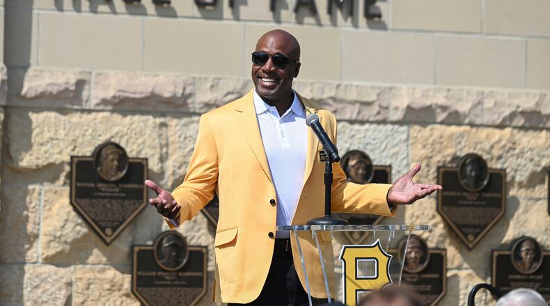 FILE - Former Pittsburgh Pirates outfielder Barry Bonds acknowledges the crowd during a ceremony for players that are part of the team's 2024 Hall of Fame class before a baseball game against the Cincinnati Reds in Pittsburgh, Aug. 24, 2024. (AP Photo/Barry Reeger, File)