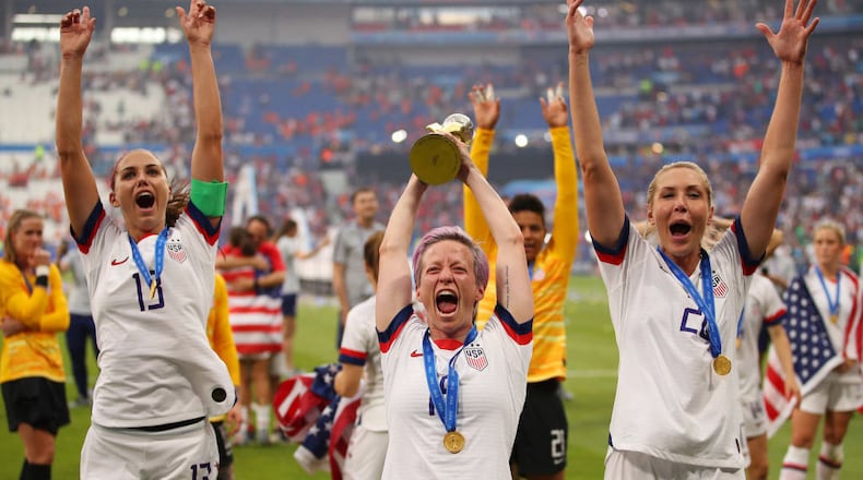 Megan Rapinoe of the USA celebrates with the FIFA Women's World Cup Trophy following her team's victory in the 2019 FIFA Women's World Cup France Final match between The United States of America and The Netherlands.