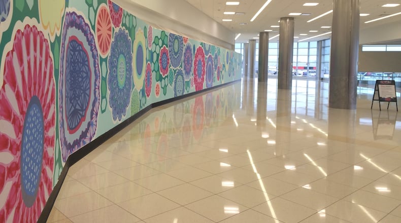 Empty spots line the Concourse C food court area at Hartsfield-Jackson, due to a longrunning delay in awarding contracts to concessionaires.