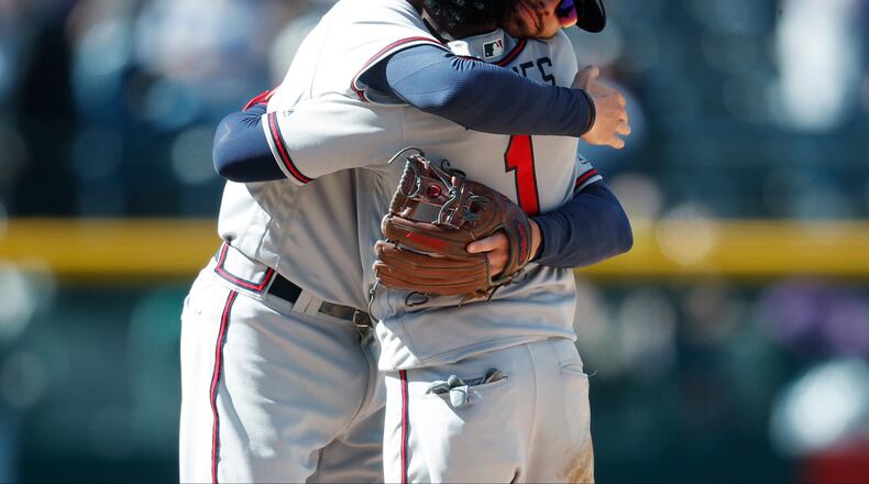 Dansby and Ozzie hug it out.