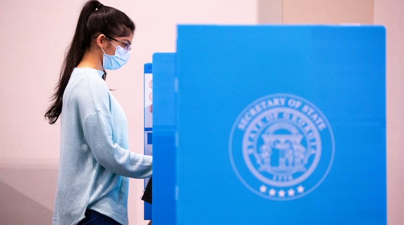 A voter makes her ballot selections at the polls at Berean Baptist Church in Lilburn, Ga., on Tuesday, Nov. 3, 2020. (Casey Sykes for The Atlanta-Journal Constitution)