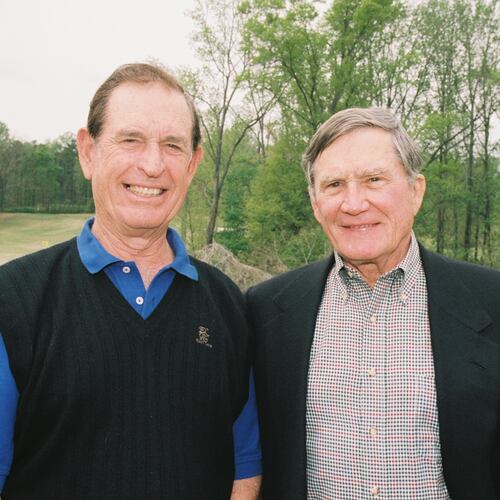 An undated photo of Charlie Harrison (left, in sweater vest) with his cousin, real estate mogul Tom Cousins at the Charlies Yates Golf Course in the East Lake neighborhood of Atlanta. (Courtesy/East Lake Foundation)