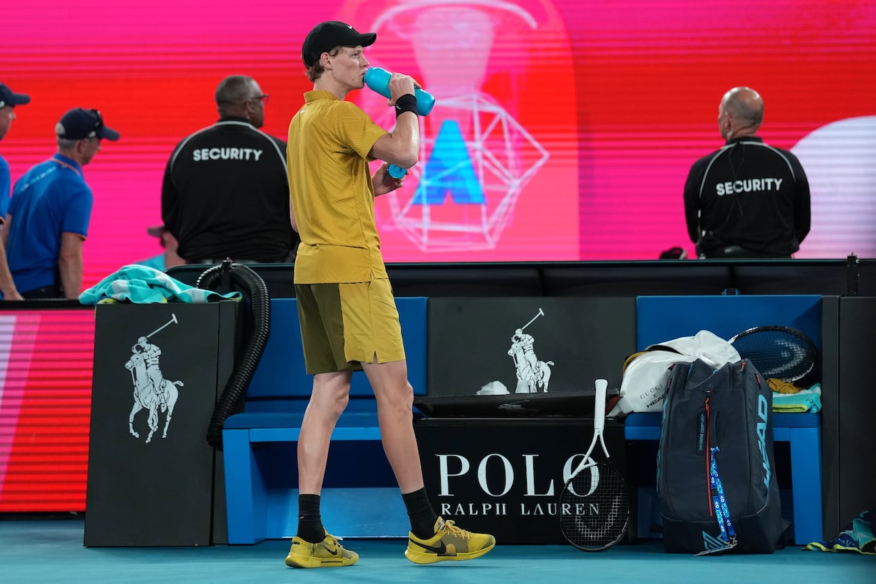 Jannik Sinner of Italy takes a drink during his third round match against Eliot Spizzirri of the U.S. at the Australian Open tennis championship in Melbourne, Australia, Saturday, Jan. 24, 2026. (AP Photo/Dita Alangkara)