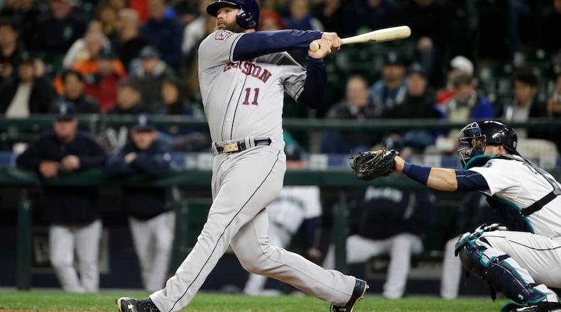 Former Brave Evan Gattis led Houston in home runs and RBIs this season. Tonight he will be opposed by another former Braves' catcher, Brian McCann. (AP photo)