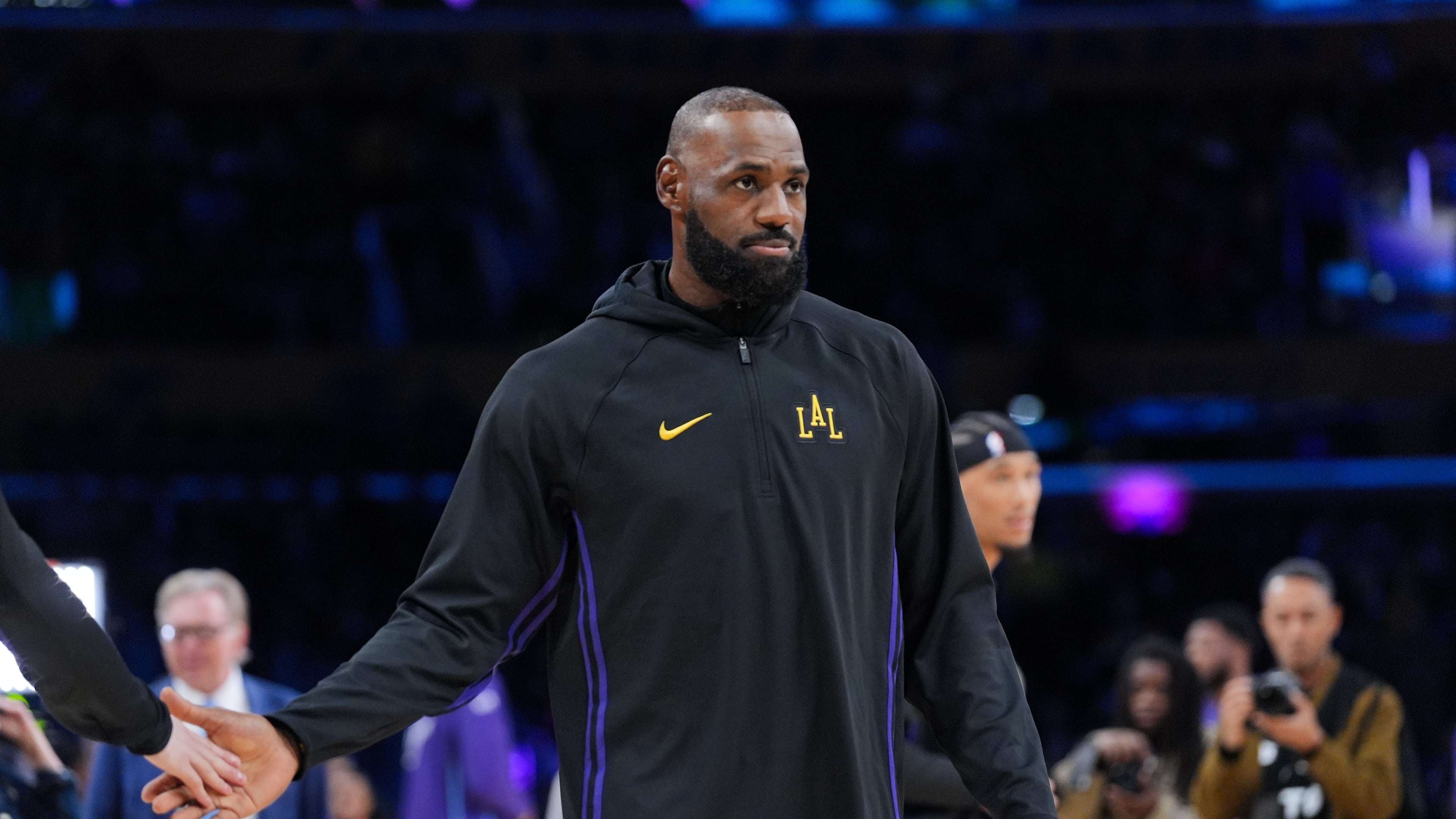 Los Angeles Lakers forward LeBron James warms up before the team's NBA basketball game against the Utah Jazz Tuesday, Nov. 18, 2025, in Los Angeles. (AP Photo/Jae C. Hong)