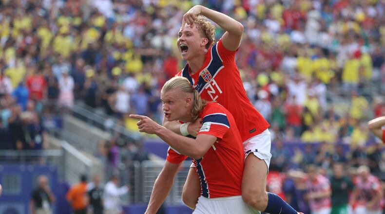 Norway's Erling Haaland (9) celebrates with Andreas Schjelderup (21) after scoring their second goal during the World Cup round of 16 soccer match between Brazil and Norway in East Rutherford, N.J., near New York, Sunday, July 5, 2026. (AP Photo/Pamela Smith)